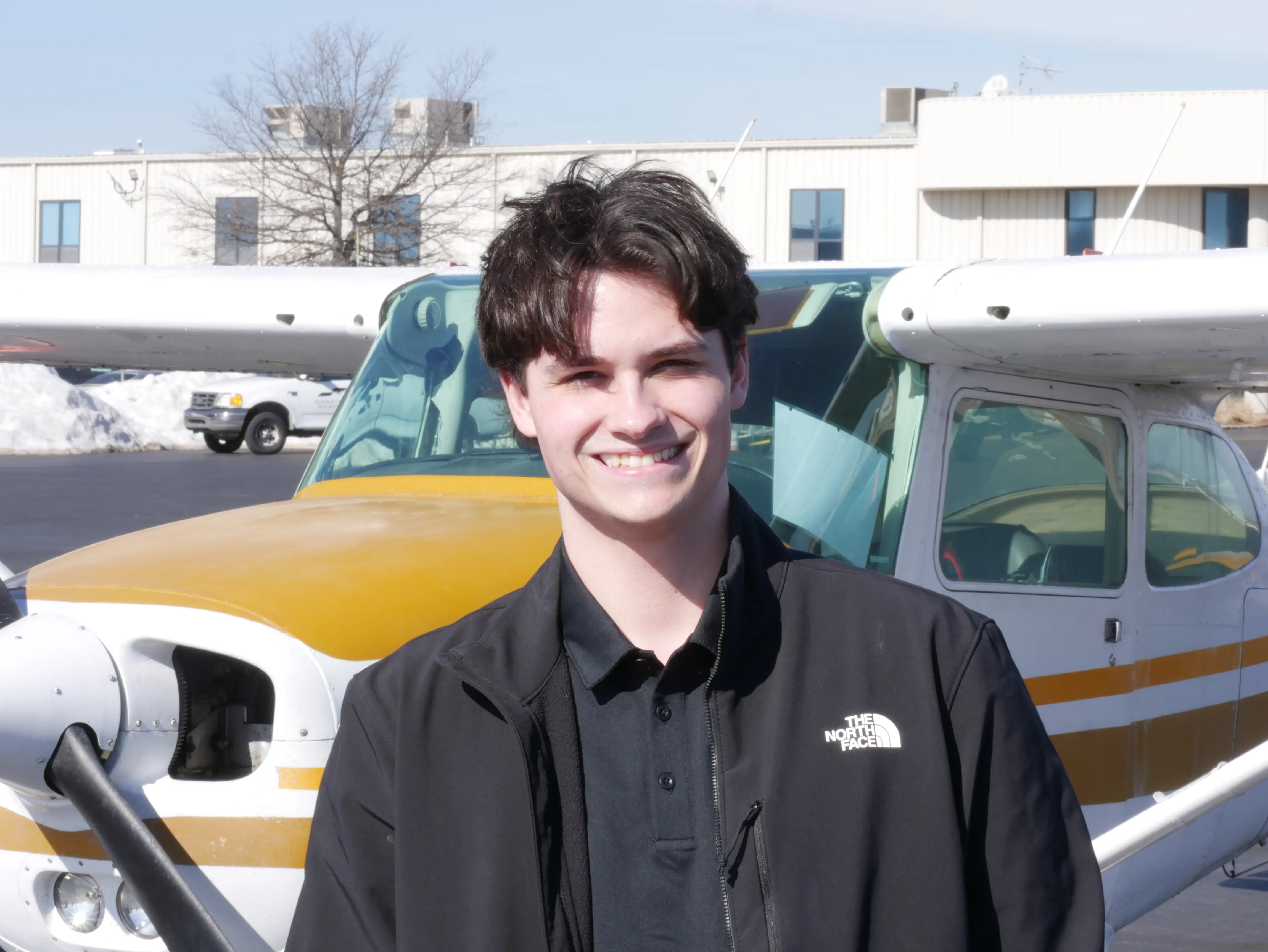 Pilot Instructional Center New Century KS - Logan Fahy CFI with Cessna in background