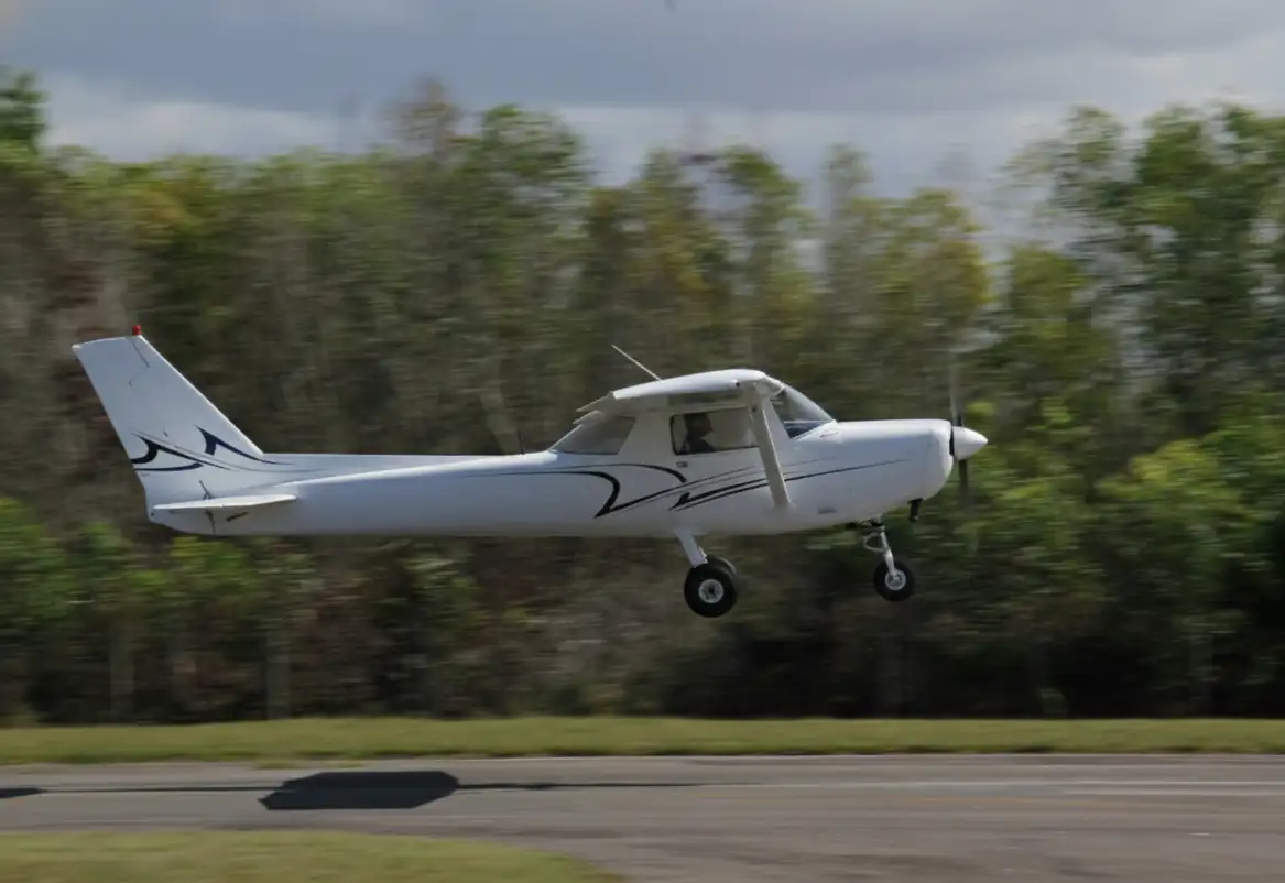 Pilot standing by aircraft